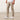 model showing side of the Around The Clock Pants in khaki