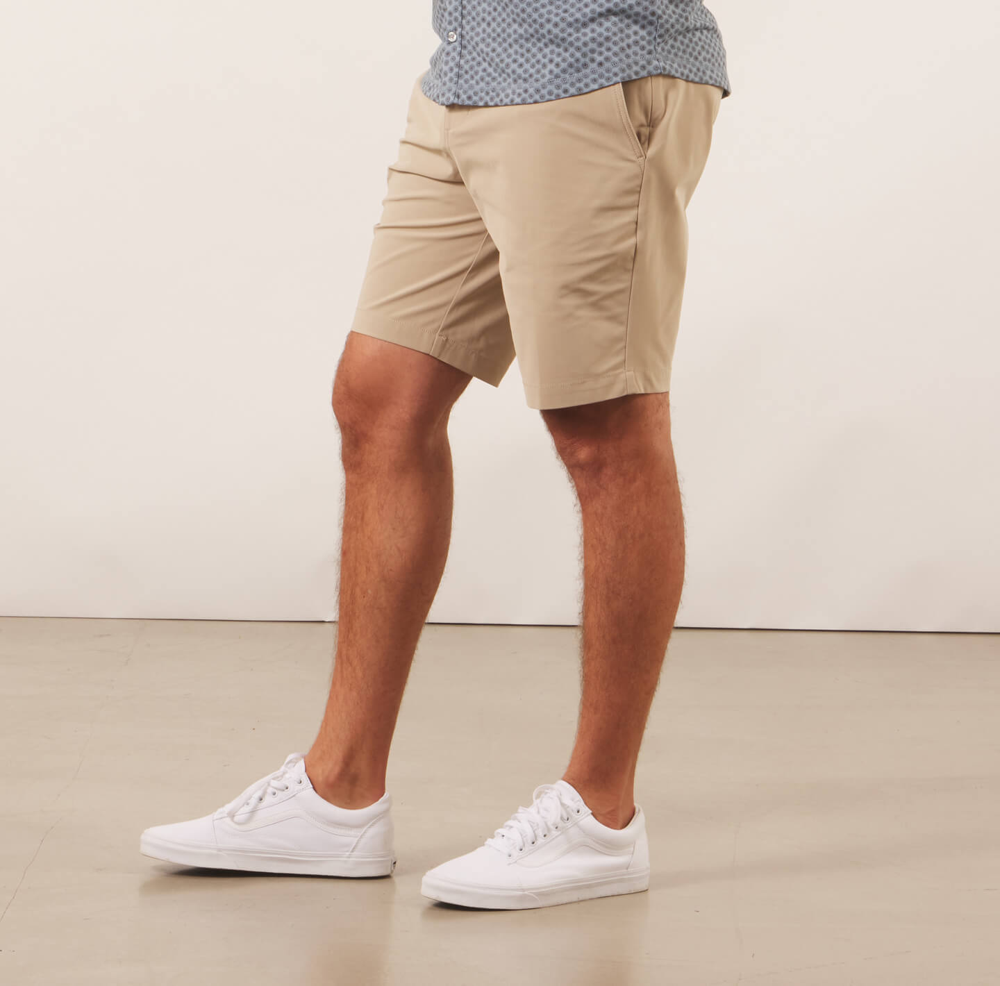 model showing the Around The Clock khaki shorts from the side